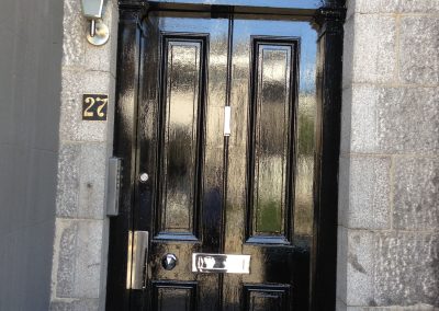 Rose house number 27 with black door