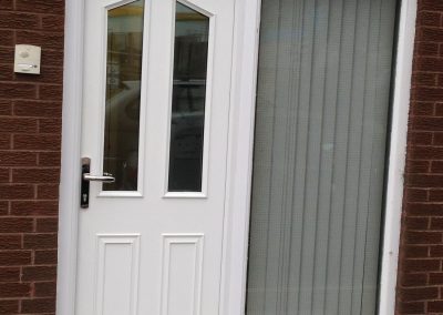 White door to reception with blind closed