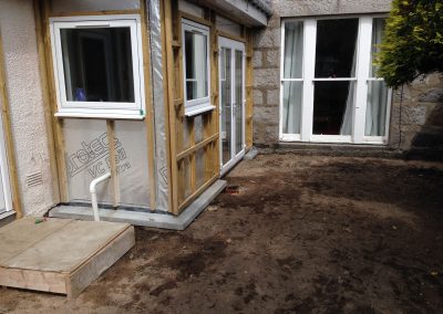 insulation added to conservatory, levelled surface outside